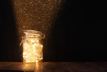 Low Key And Vintage Filtered Image Of Fairy Lights In Mason Jar With. Selective Focus.
