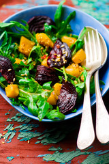 Sticker - vegetable salad with pumpkin, beet, arugula .