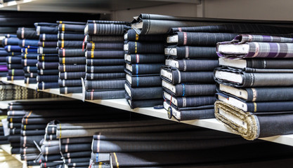 Wall Mural - Rolls of fabric and textiles in a factory shop or  store