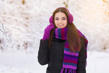 Fototapeta Koty - Young woman in winter park