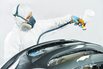 Wall Mural - worker painting auto car bumper