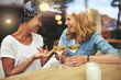 © Flamingo Images - Two attractive women enjoying a glass of wine