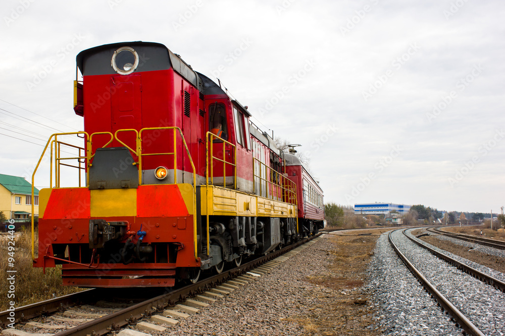 red-yellow locomotive train on the tracks Stock Photo | Adobe Stock