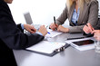 © rogerphoto - Group of business people working together in office