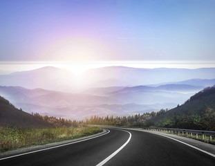 Highway against mountains.