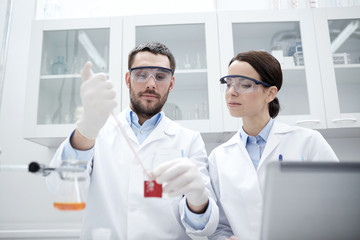 Wall Mural - young scientists making test or research in lab