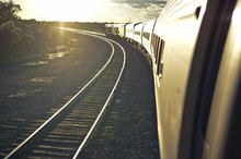 Passenger Train Traveling Into The Arizona Sunset