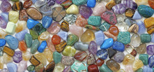Multicolored Tumbled Crystal Stones Background - A Large Quantity Of Different Colored Healing Tumbled Gem Stones Making Up A Backdrop For Use As A Background