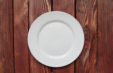 White Empty Plate On Wooden Table
