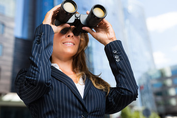 Wall Mural -     Businesswoman using binoculars