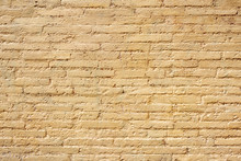 Brick Wall With Yellow Paint