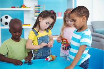 Wall Mural - Happy kids enjoying arts and crafts together