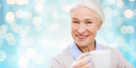 Sticker - happy senior woman with cup of tea or coffee