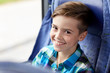 © Syda Productions - happy boy sitting in travel bus or train