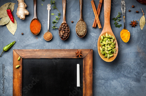 Various Spices near blackboard Canvas Print