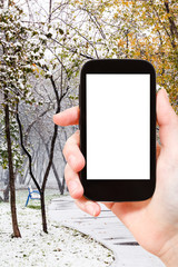 Poster - smartphone and first snowfall in city park