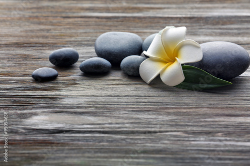 Naklejka - mata magnetyczna na lodówkę Spa stones with flower on wooden background