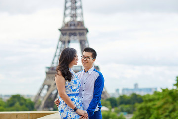 Young romantic Asian couple in Paris, France