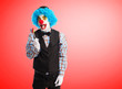 © asierromero - portrait of a funny clown holding a lollipop