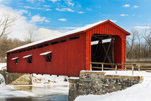 Red Covered Bridge With Snow