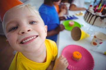 Wall Mural - Excited kid enjoying a birthday party