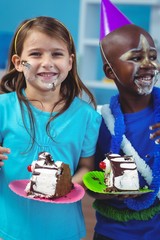 Wall Mural - Happy kids eating birthday cake