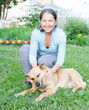 © DariaTrofimova - woman with   dog in   yard.