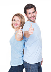 Wall Mural - Portrait of happy couple with thumbs up.