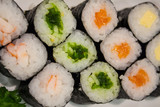 Fototapeta Kwiaty - Sushi rolls on a plate