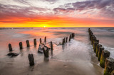 Fototapeta Morze - sunset over the sea beach