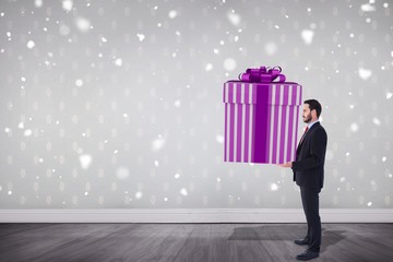 Poster - Composite image of stylish man with giant gift