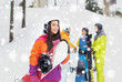 © Syda Productions - happy friends in helmets with snowboards