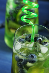 Canvas Print - Kiwi and Blueberry cocktail on wooden background