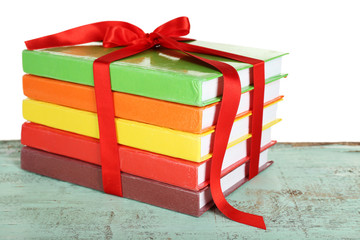 Canvas Print - Stack of books with ribbon on light background