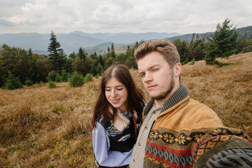 Wall Mural - stylish beautiful traveling tender happy couple in the mountains