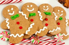 Group Of Christmas Gingerbread Man Cookies On Plate With Candy