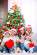 © Anna Om - Happy family near Christmas tree