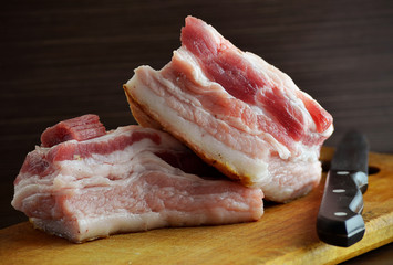 slices of fresh raw pork bacon