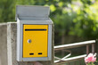 Open mailbox on the fence, shot with low depth of field