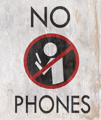 no phones sign on wood grain texture