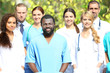 © Africa Studio - Smiling medics team, outdoors