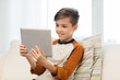 © Syda Productions - smiling boy with tablet computer at home