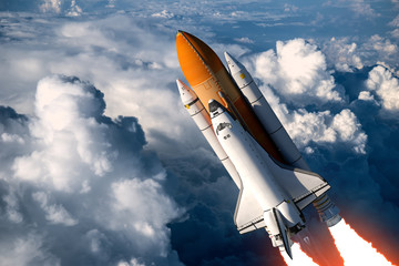 Wall Mural - space shuttle launch in the clouds