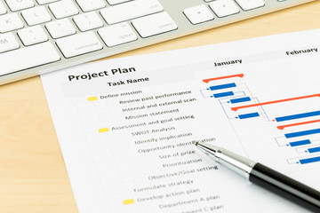 Project management and gantt chart with keyboard and pen