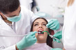 © V&P Photo Studio - dentist curing a girls teeth