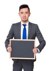 Canvas Print - Asian Businessman showing the chalkboard