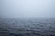 Calm surface of a sea during a foggy day