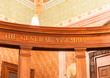 The General Assembly sign on wooden beam inside Illinois State C