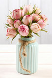 Fototapeta Kwiaty - Bouquet of pink roses in turquoise ceramic vase