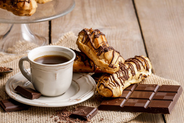 Wall Mural - Cup of coffee and eclairs